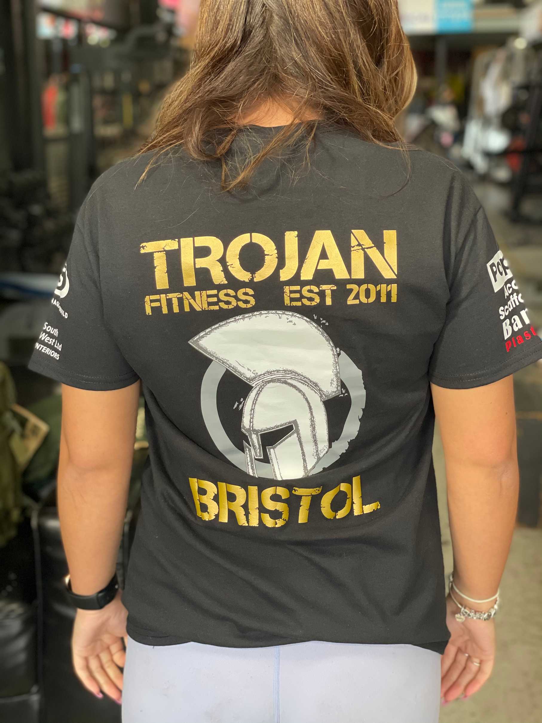 Womens Black/Gold Sponsors Trojan logo T-Shirt